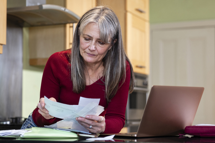 A taxpayer gathering documents to file her taxes.