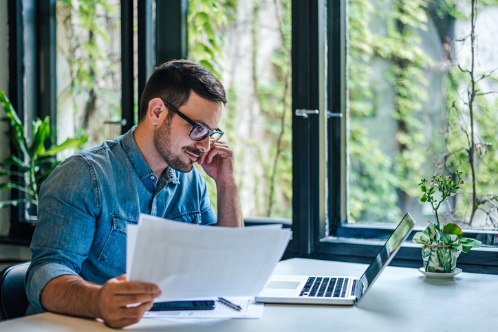 A man reviewing his early retirement plan.