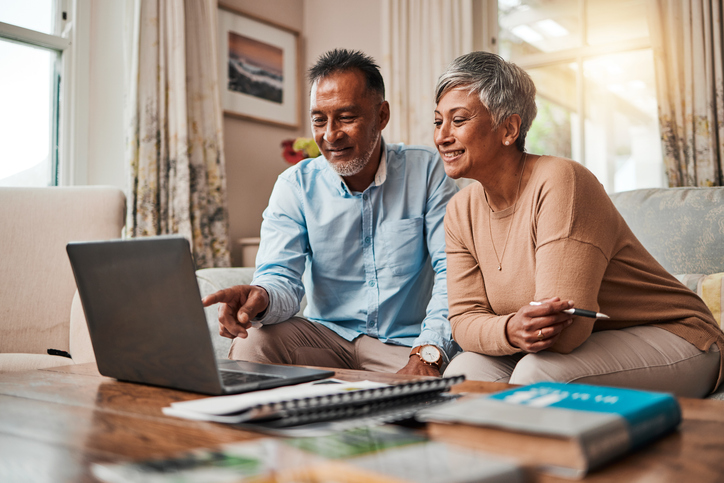 A senior couple reviewing their pension plans.