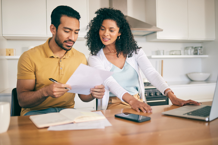 A couple reviewing how much they can deduct from mortgage interest.