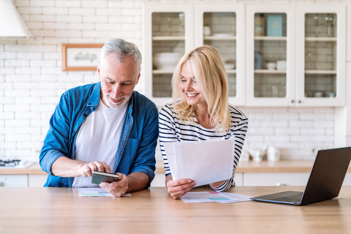 A couple calculating how much they will need to retire comfortably.